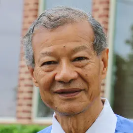 A man wearing a blue-and-white polo